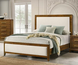 Wooden bed with white bedding and green pillows in a bedroom setting.