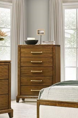 Wooden dresser with gold handles in a bedroom setting