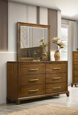 Wooden dresser with mirror in a bedroom setting
