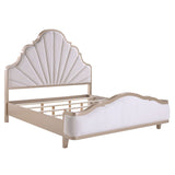 Beige bed frame with scalloped headboard on a white background