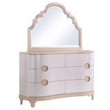 Dresser with round knobs and an arched mirror on a white background