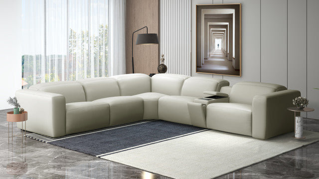 Modern living room with a beige sectional sofa, coffee table, and decorative items | Home Elegance USA