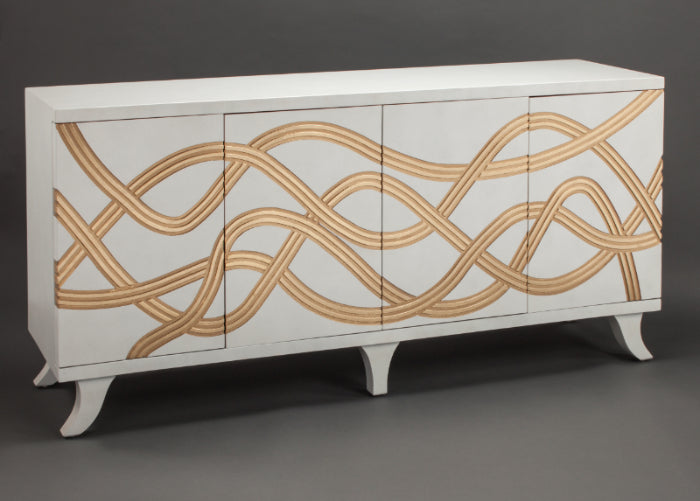 White cabinet with gold wavy patterns on a dark background