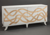 White cabinet with gold wavy patterns on a dark background