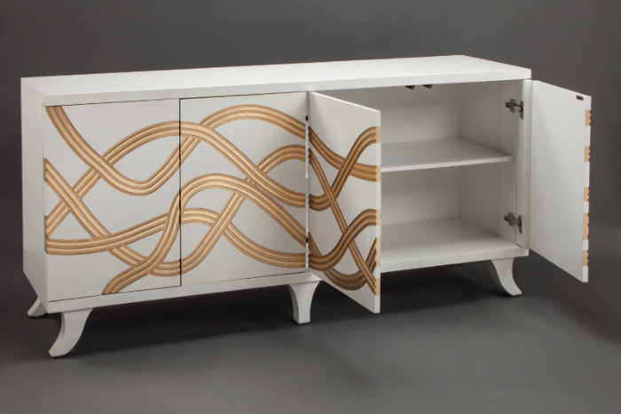 White cabinet with gold geometric patterns on a gray background