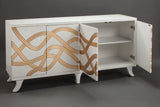 White cabinet with gold geometric patterns on a gray background