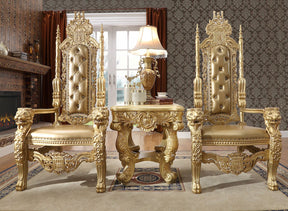 Ornate gold throne chairs in a luxurious room with a fireplace and lamp.