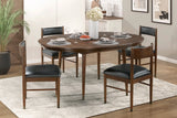 Dining room with a wooden table and chairs on a rug
