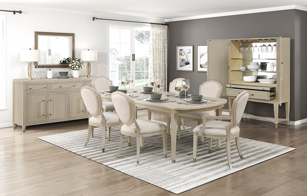 Dining room with a table set for dinner, chairs, and a sideboard.