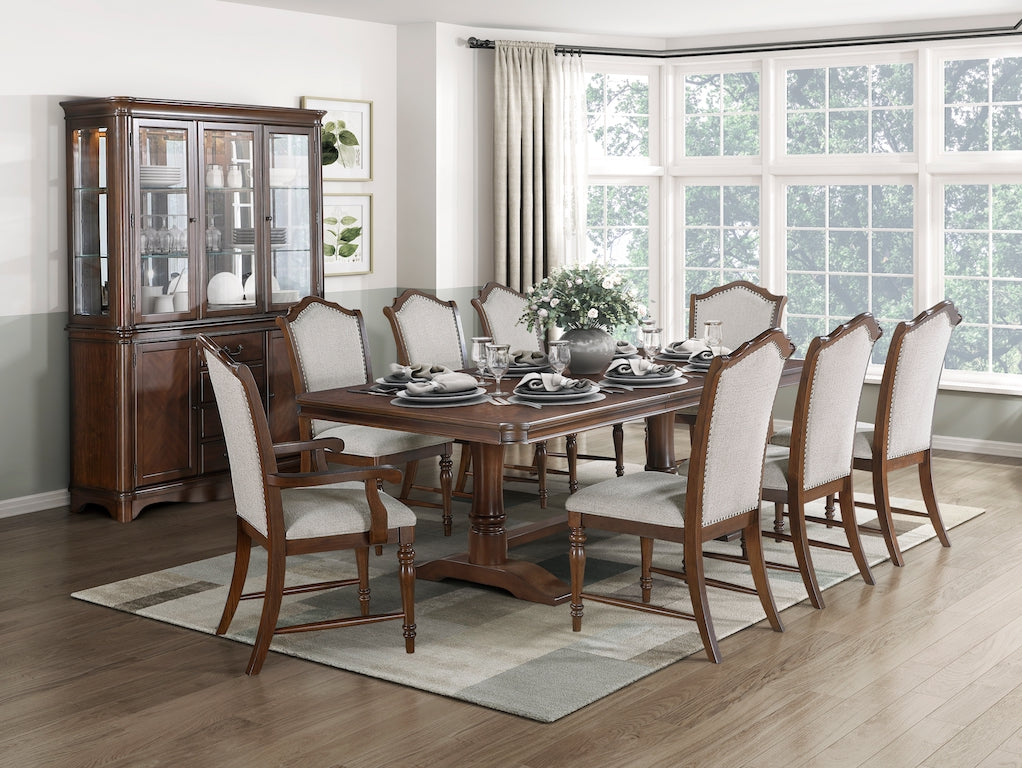 Dining room with wooden table and chairs, glass cabinet, and large windows.