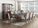 Dining room with wooden table and chairs, glass cabinet, and large windows.