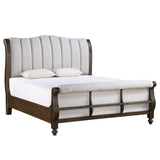 Sleigh bed with upholstered headboard and wooden frame on a white background