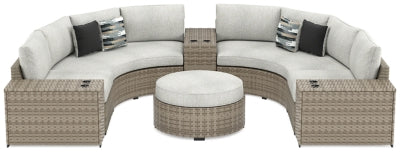 Ashley Beige Calworth P458P5 7-Piece Outdoor Sectional with Ottoman