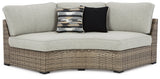 Ashley Beige Calworth Curved Loveseat with Cushion