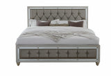 Bed with tufted headboard and footboard on a white background