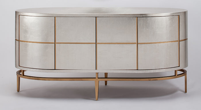 Decorative cabinet with metallic finish and gold accents on a white background