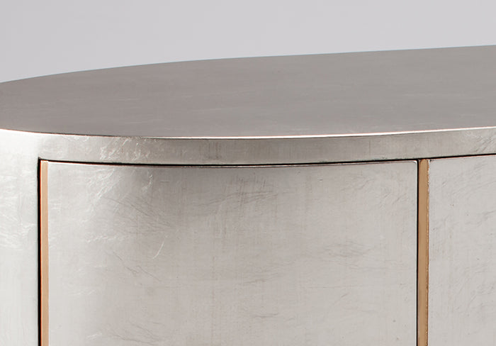 Metallic surface with a reflective finish on a gray background