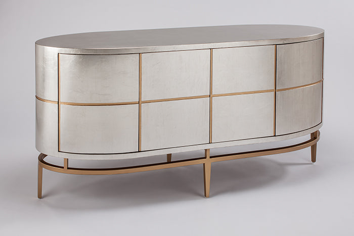 Silver and gold oval dresser on a white background