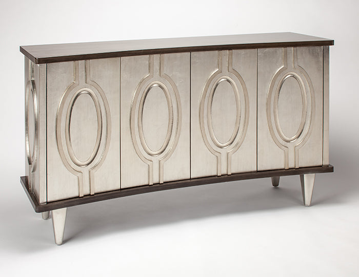 Decorative console table with mirror-like surface and oval designs on a white background