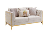 Beige sofa with decorative pillows on a white background