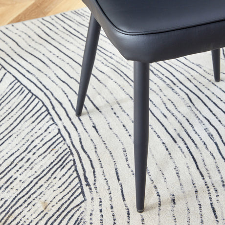 Table and chair set. 64.5 x 35.4 Inch Stylish Black Wood Color Textured Dining Table.Paired with 4 Black PU chairs with a vertical stripe design on the backrest and black metal legs. - sold by Home Elegance USA