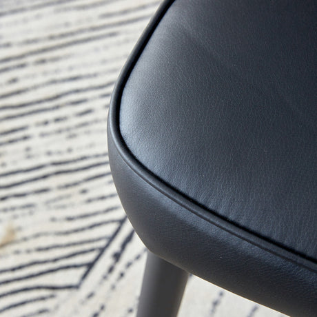 Table and chair set. 64.5 x 35.4 Inch Stylish Black Wood Color Textured Dining Table.Paired with 4 Black PU chairs with a vertical stripe design on the backrest and black metal legs. - sold by Home Elegance USA
