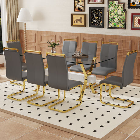 Table and chair set.Elegant Transparent Tempered Glass Dining Set - 71'x35.4' with 8 Dark Gray PU Chairs with golden C-tube metal leg. - sold by Home Elegance USA