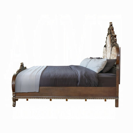 Decorative bed with intricate carvings on a white background