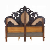 Decorative wooden headboard with intricate carvings on a white background