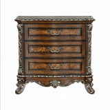 Decorative wooden chest of drawers with intricate carvings on a white background