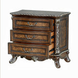 Decorative wooden dresser with ornate details on a white background
