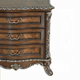Decorative wooden dresser with intricate carvings on a white background