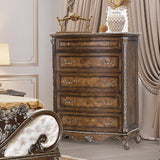 Decorative wooden dresser with intricate carvings in a bedroom setting.