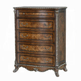 Wooden dresser with decorative carvings on a white background