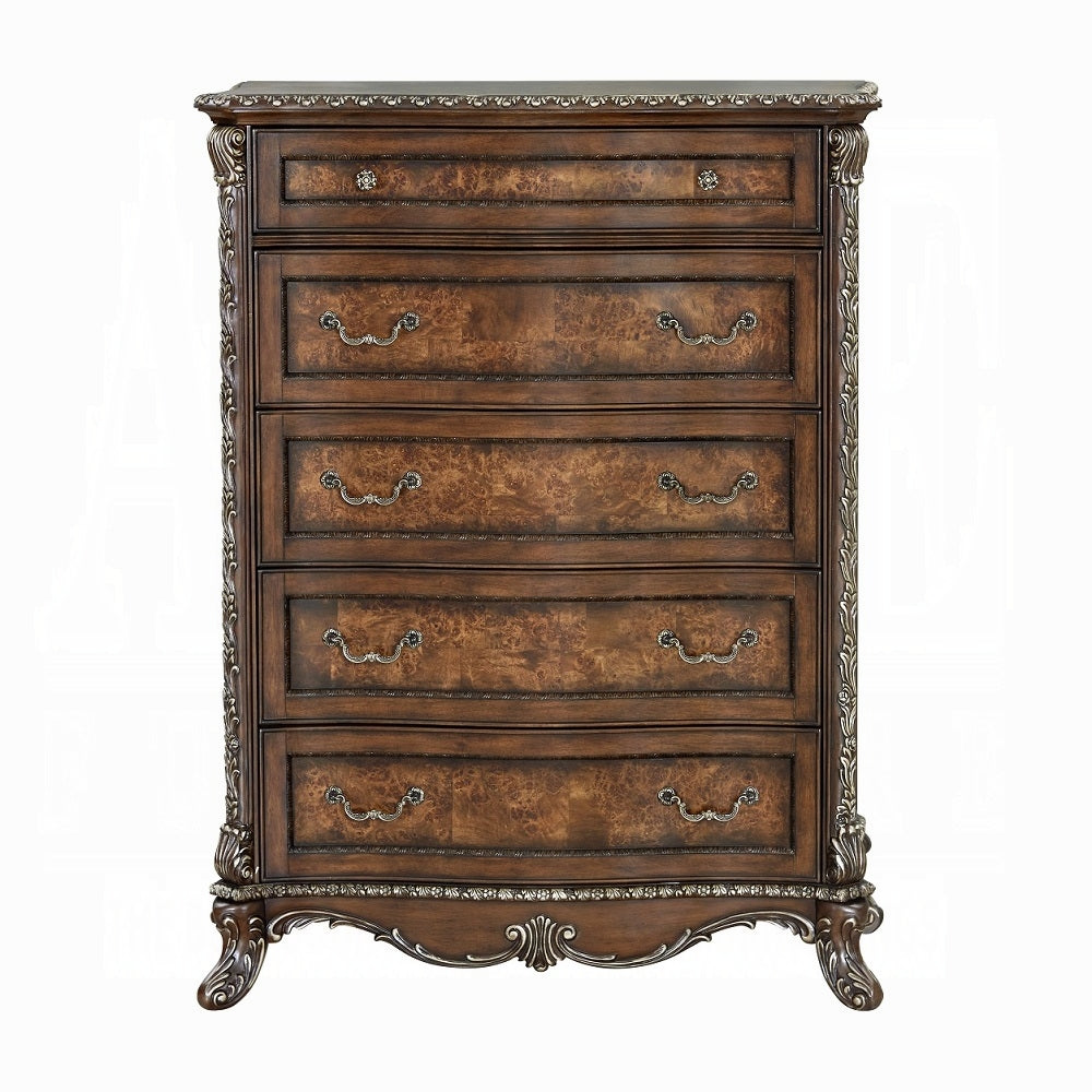Wooden dresser with decorative carvings on a white background