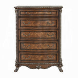 Wooden dresser with decorative carvings on a white background