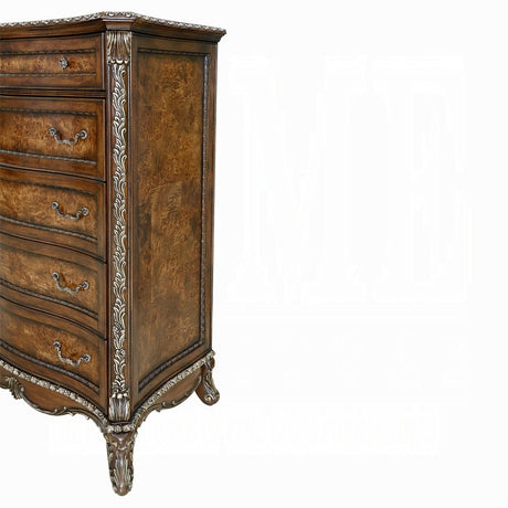 Wooden dresser with intricate carvings on a white background