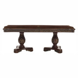 Decorative wooden table with intricate carvings on a white background