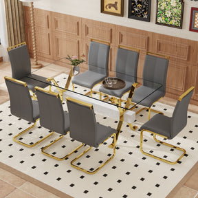Table and chair set.Elegant Transparent Tempered Glass Dining Set - 71'x35.4' with 8 Dark Gray PU Chairs with golden C-tube metal leg. - sold by Home Elegance USA