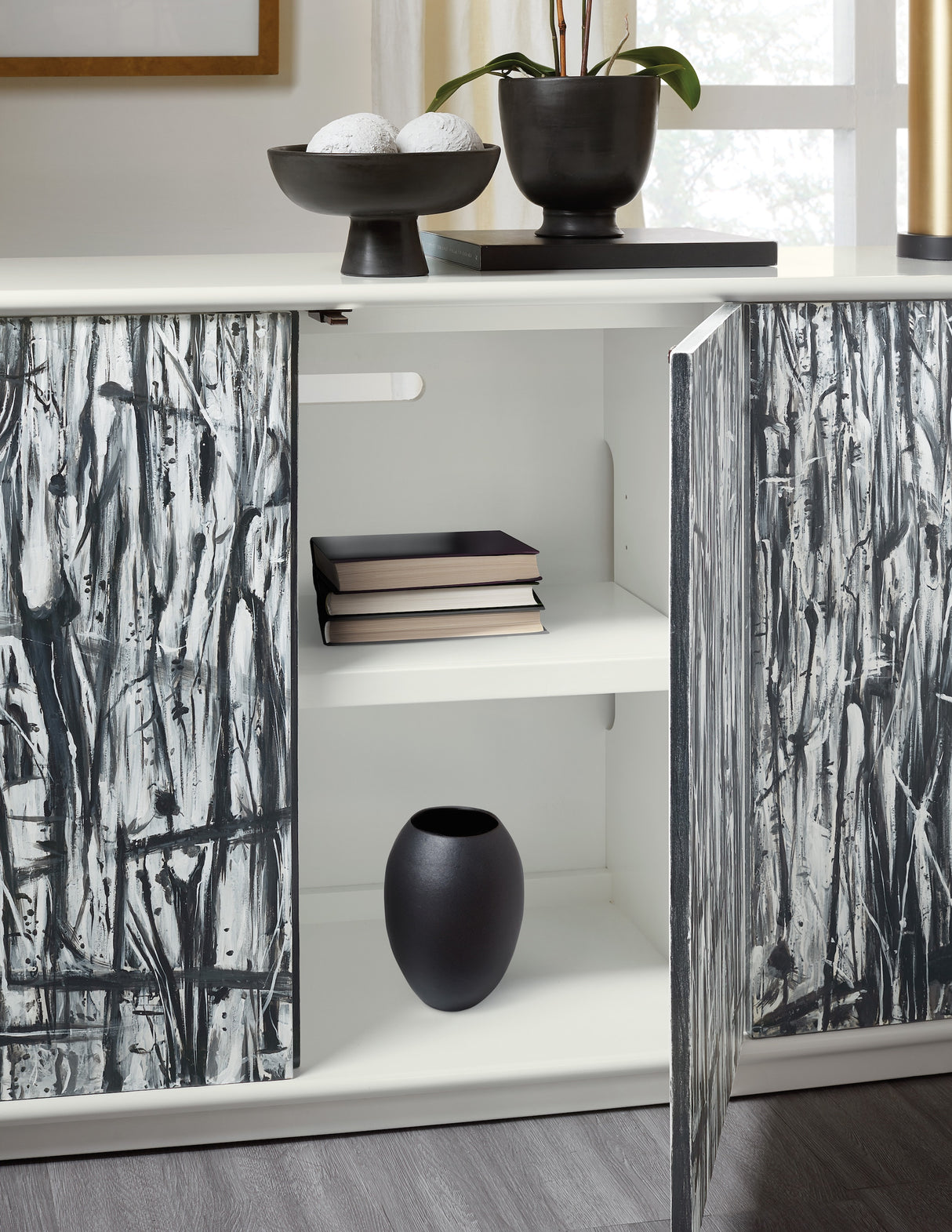 Interior storage of the Mélange Graffitio Credenza showing adjustable shelves and touch-latch cabinet doors.