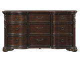 Royal Highlands 9-drawer dresser in dark cherry finish with bronze ring pulls and carved serpentine design. Dimensions 72W × 20D × 39H. Includes assembly hardware.