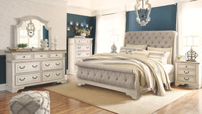 Realyn - Two-Tone - 7 Pc. - Dresser, Mirror, King Upholstered Sleigh Bed, 2 Nightstands | Ashley